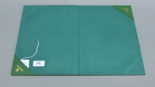 A Rolex stationery folder. 22 cm wide.