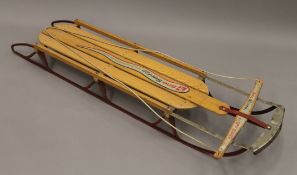 A vintage Sno Surfer sledge. 155 cm long.