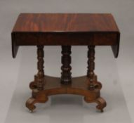 A 19th century mahogany pedestal sofa table. 85 cm wide flaps down.