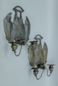 A pair of wall sconces formed as bats. Each 34 cm high.
