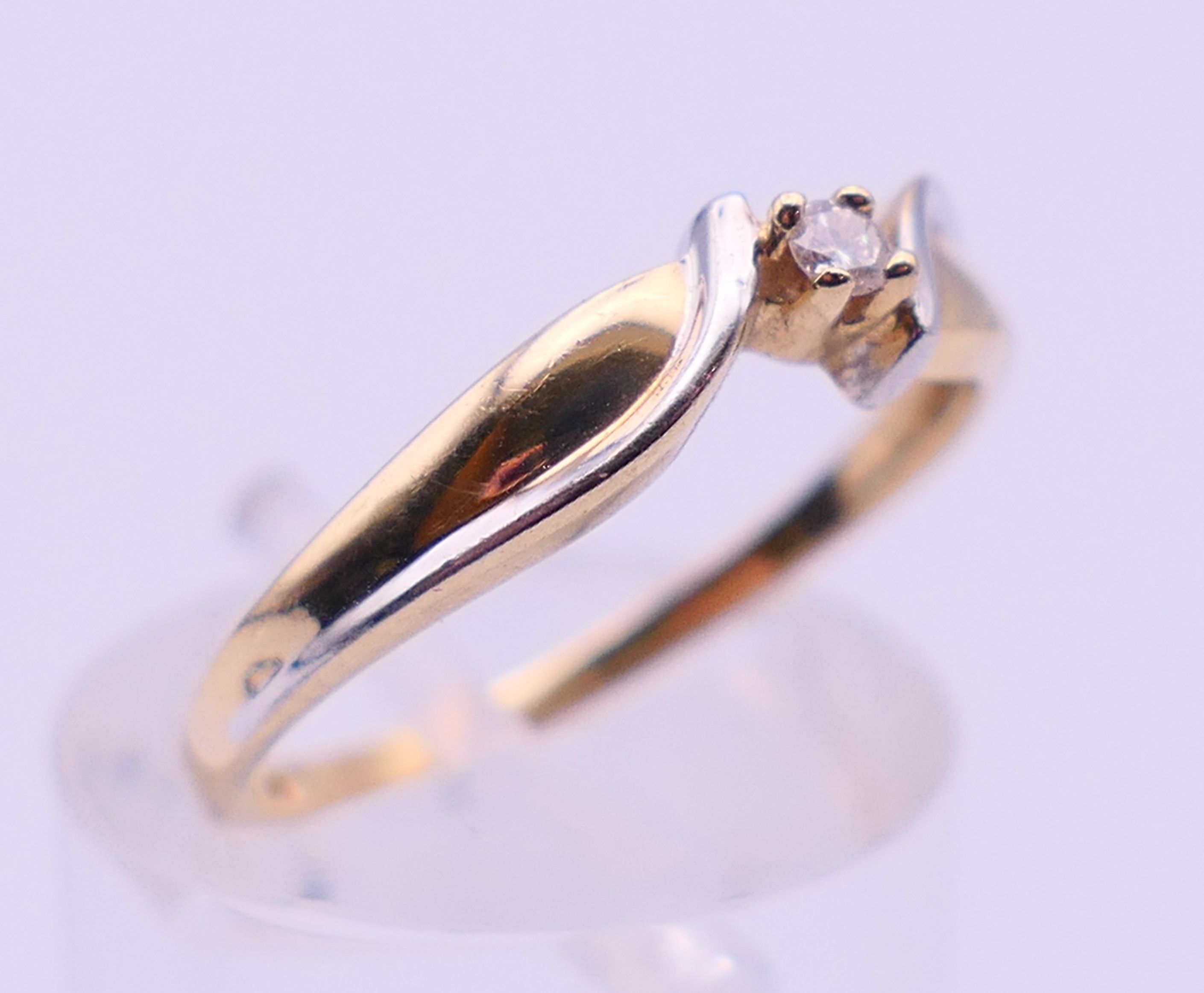 A 10 ct bi-colour gold diamond solitaire ring. Ring size N. 1.6 grammes total weight. - Image 3 of 5