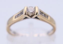 An 18 ct gold and diamond ring. Ring size K/L. 2.5 grammes total weight.