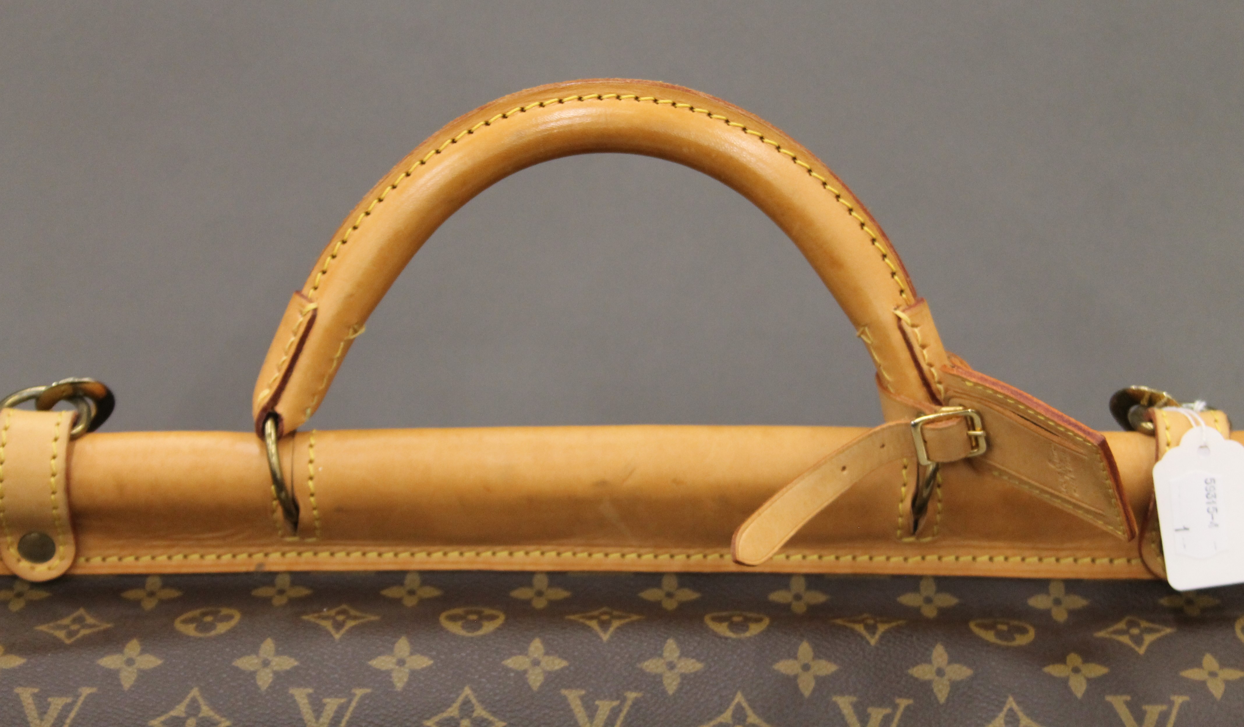 A vintage 1980's Louis Vuitton three-pocket travel bag with leather trim and shoulder strap. - Image 2 of 16