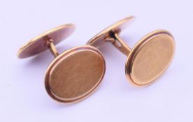 A pair of gold cufflinks. 2 x 1.5 cm. 12.5 grammes total weight.
