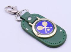 A Rolex Wimbledon keyring, boxed. 10.5 cm high.
