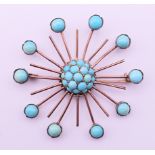 A turquoise set brooch. 5 cm diameter.