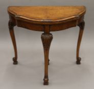 An early 20th century walnut card table. 84 cm wide.