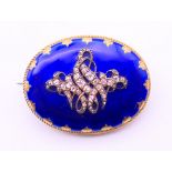 A 19th century diamond and blue enamel mourning brooch. 3.5 x 2.75 cm.