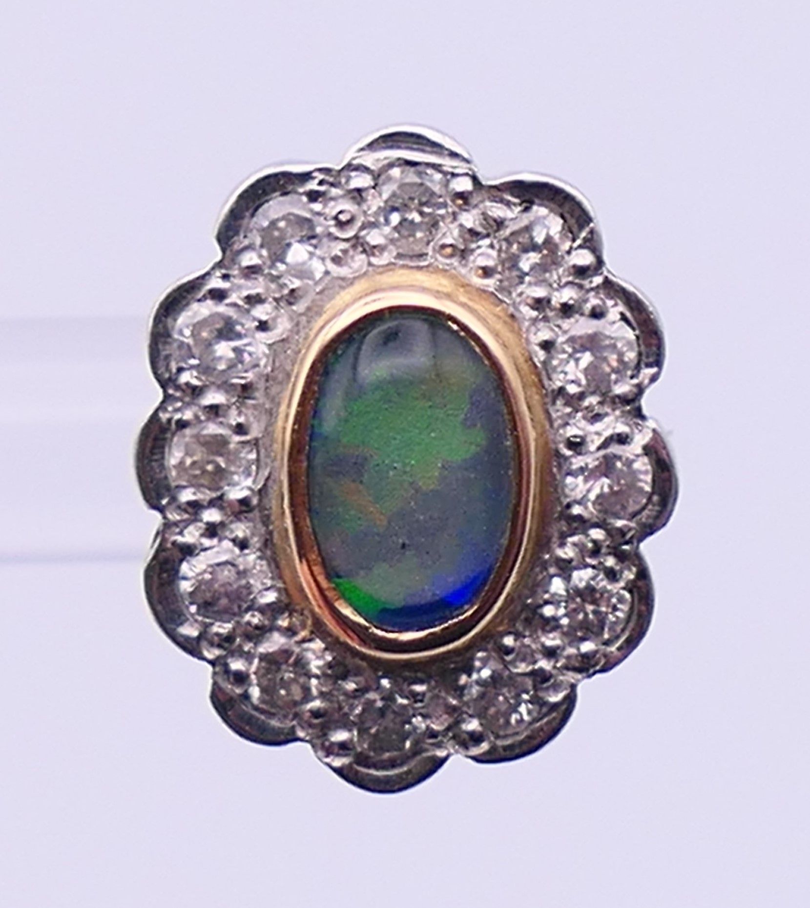 A pair of unmarked gold, diamond and opal earrings. 1.25 cm high. - Image 4 of 6