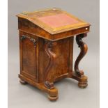 A Victorian burr walnut Davenport, the top with inset presentation inscription. 55 cm wide.