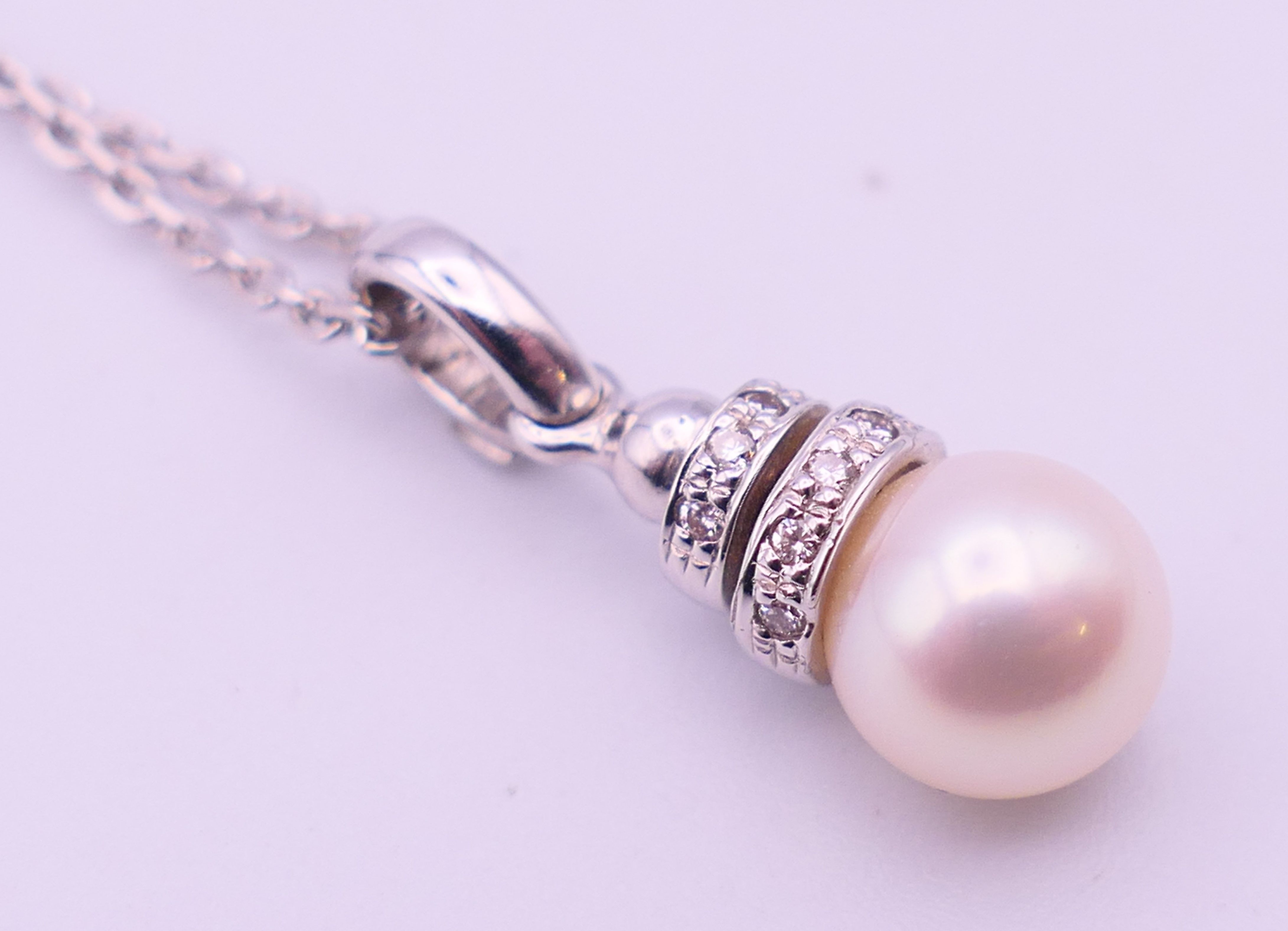An 18 ct white gold, diamond and pearl drop pendant on a chain. Pendant 2. - Image 6 of 6