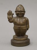 A bronze car mascot formed as a policeman, mounted on a plinth base. 11 cm high.