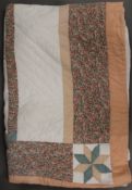A mid-20th century vintage patchwork quilt. 247 x 180 cm.