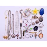 A quantity of costume and silver jewellery to include brooches, necklaces, earrings,