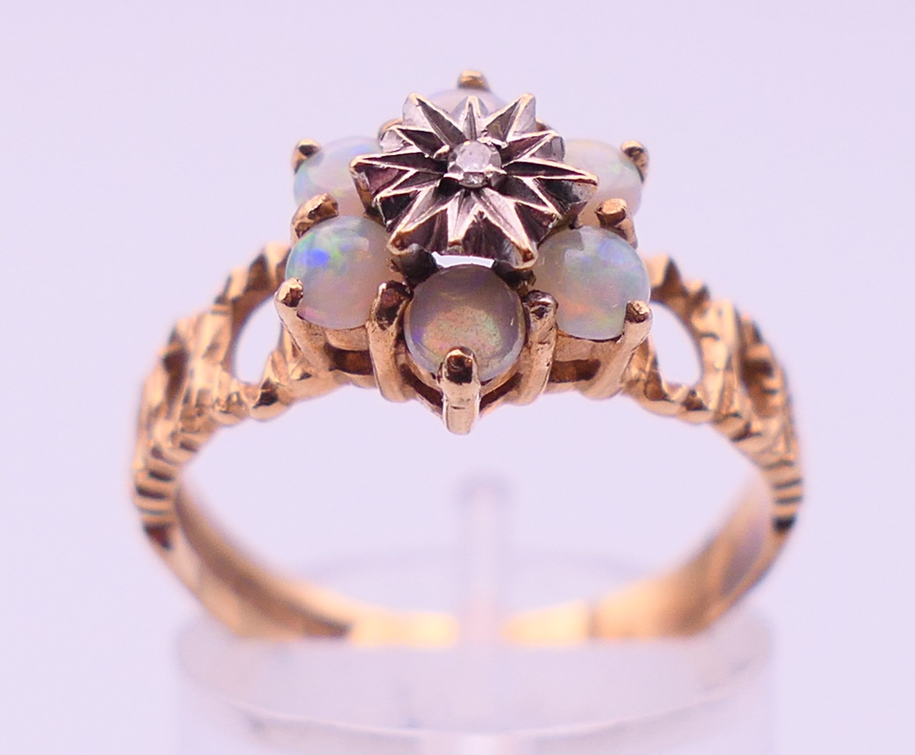 A 9 ct gold, diamond and opal ring. Ring size P/Q. 3.3 grammes. - Image 2 of 5