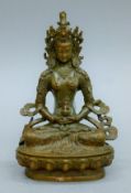 A Chinese bronze seated Buddha. 15 cm high.