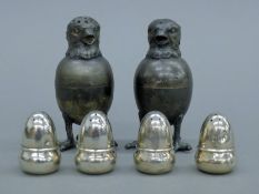 A pair of silver-plated chick-form peppers and four silver acorn-form peppers. The former each 7.