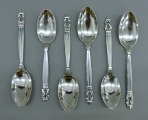 Six Georg Jensen silver spoons. The four larger each 20 cm long. 355.2 grammes.