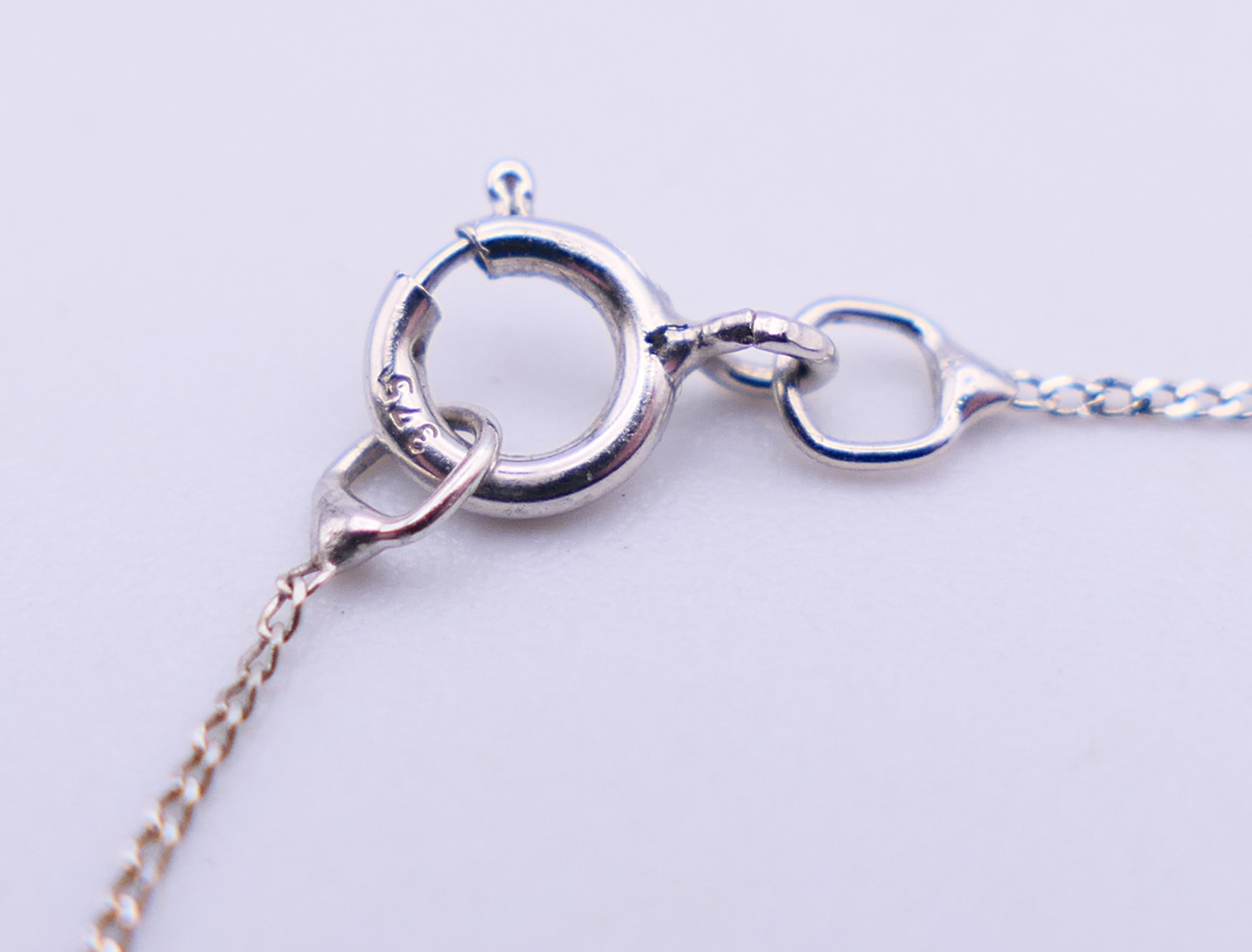 A 9 ct white gold and diamond double heat pendant on a 9 ct white gold chain. Pendant 1. - Image 8 of 8