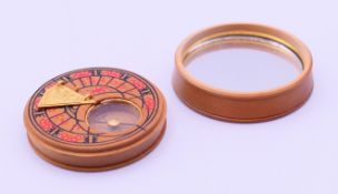 A small box wood pocket sundial. 3.5 cm diameter.