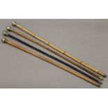 Four George V military swagger sticks including the Cambridgeshire Regiment and the RAF.