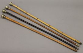 Four George V military swagger sticks including the Cambridgeshire Regiment and the RAF.