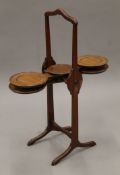 A vintage mahogany monoplane folding cake stand. 78.5 cm high.