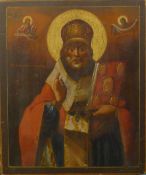 A 19th century Russian icon on wood painted with Saint Nicholas performing a miracle with Jesus and