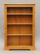 A modern pine bookcase. 83 cm wide x 122 cm high.