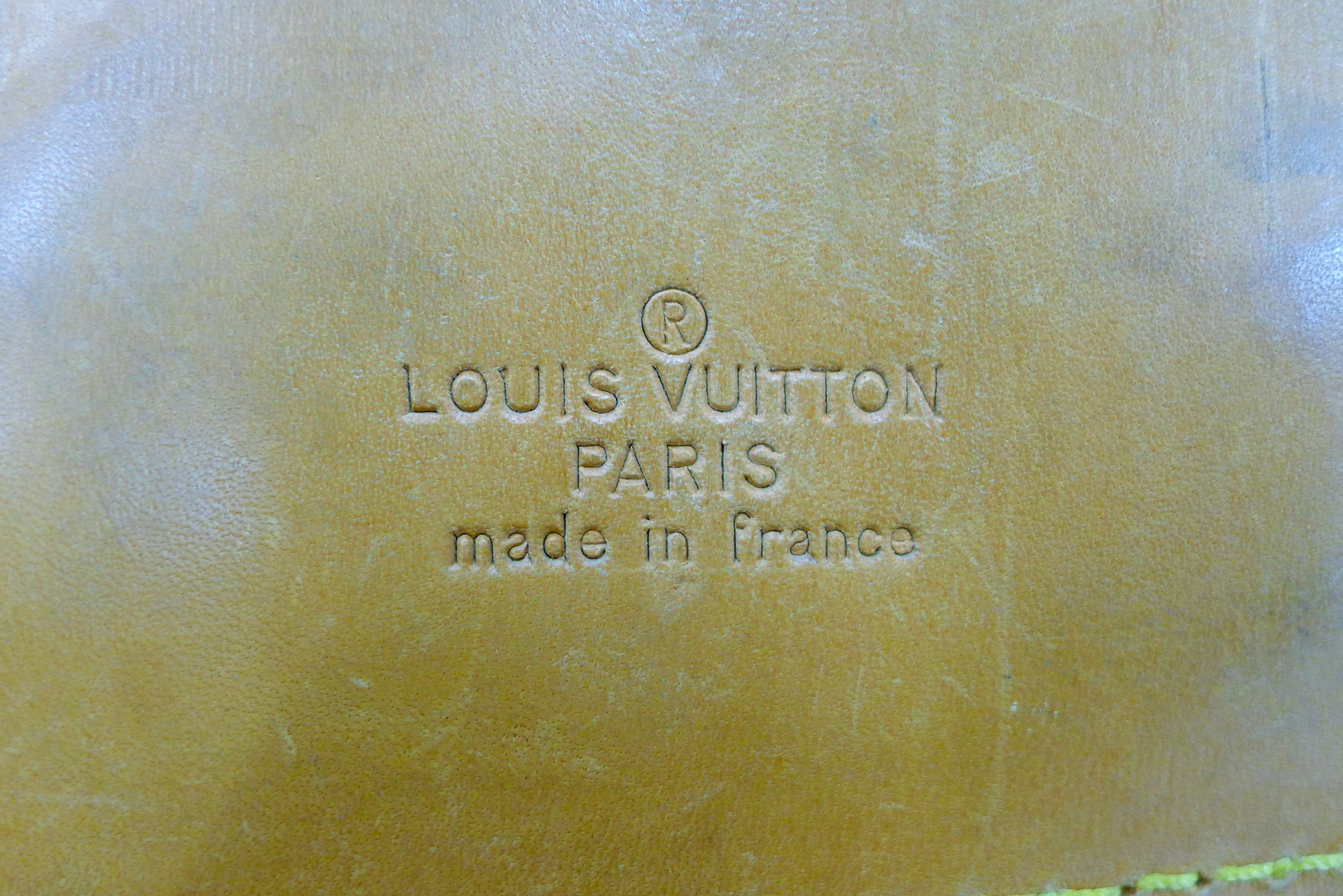 A vintage 1980's Louis Vuitton three-pocket travel bag with leather trim and shoulder strap. - Image 10 of 16