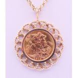 A 1913 sovereign in a 9 ct gold pendant mount on a 9 ct gold chain. Sovereign mount 3.