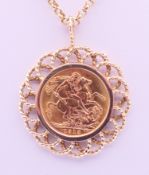 A 1913 sovereign in a 9 ct gold pendant mount on a 9 ct gold chain. Sovereign mount 3.