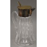 A silver plate-mounted cut glass lemonade jug. 33 cm high.