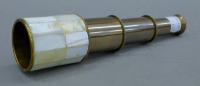 A small mother-of-pearl telescope. 18.5 cm long extended.