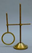 A magnifying glass on stand. 25.5 cm high.