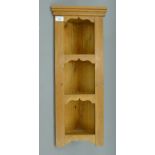 A small modern pine corner shelf. 26.5 cm wide x 67 cm high.