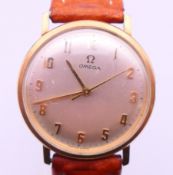 A 9 ct gold cased Omega gentlemen's wristwatch ( crown lacking ). 3.2 cm wide. 34.