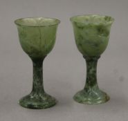 A pair of small spinach jade goblets. Each 9 cm high.