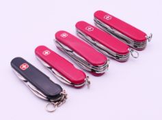 Five various Swiss Army penknives. The largest 9 cm long closed.