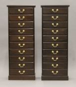 A pair of mahogany flights of drawers. Each 44 cm wide x 117 cm high.