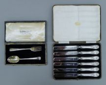 A cased Christening spoon and fork (36.7 grammes) and a cased set of silver-handled knives.