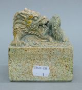 A Chinese hardstone dragon seal. 11 cm high.