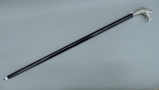 A 'Michelin man' walking stick. 97 cm long.