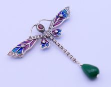 A silver plique-a-jour dragonfly brooch. 7 cm wide.