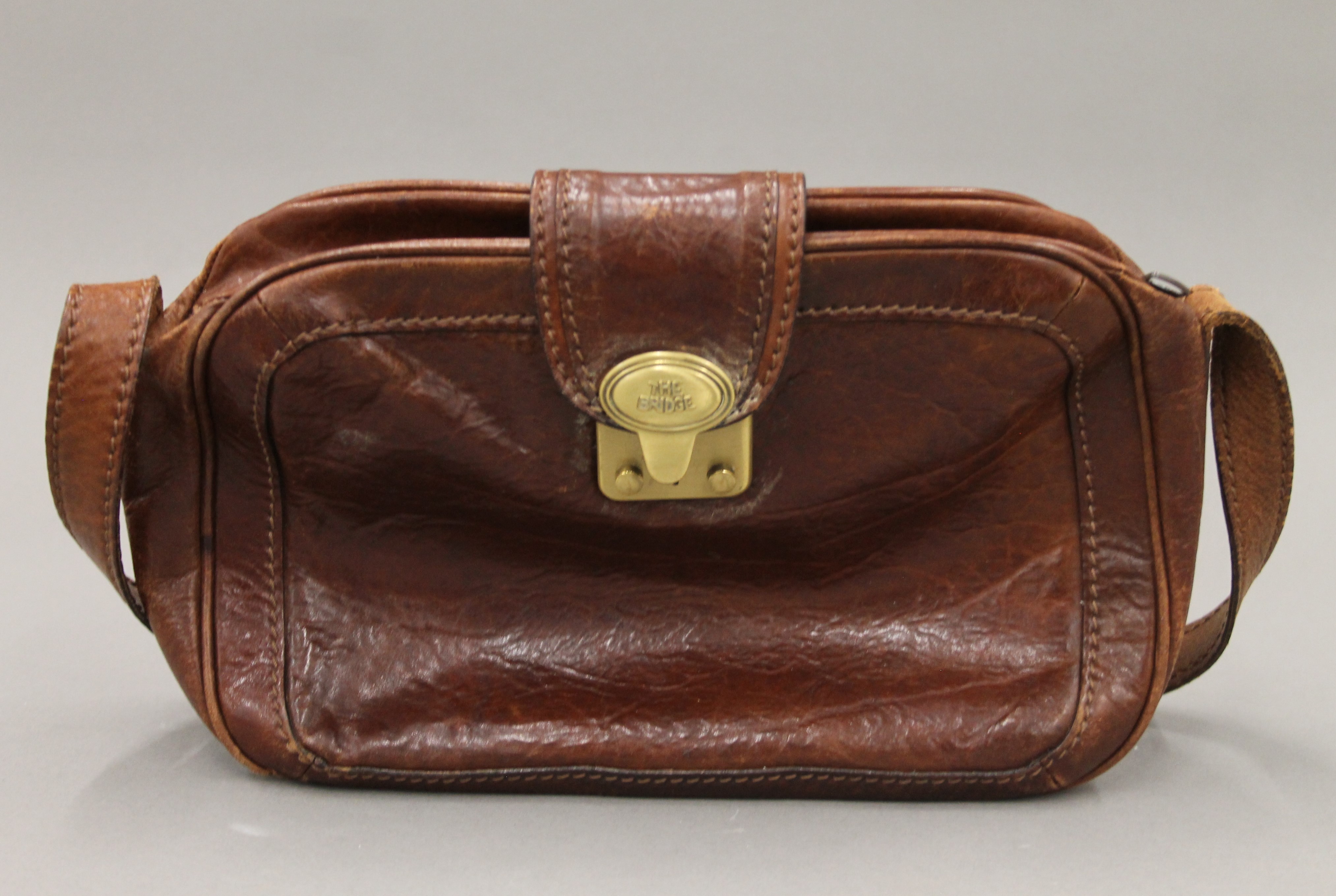 A The Bridge leather handbag and purse. The former 28 cm wide.