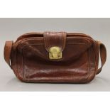 A The Bridge leather handbag and purse. The former 28 cm wide.