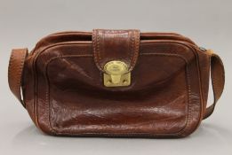 A The Bridge leather handbag and purse. The former 28 cm wide.