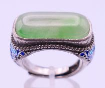 A Chinese jade extendable saddle ring.