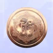 A Tiffany mirror compact rouge box. 4.25 cm diameter.