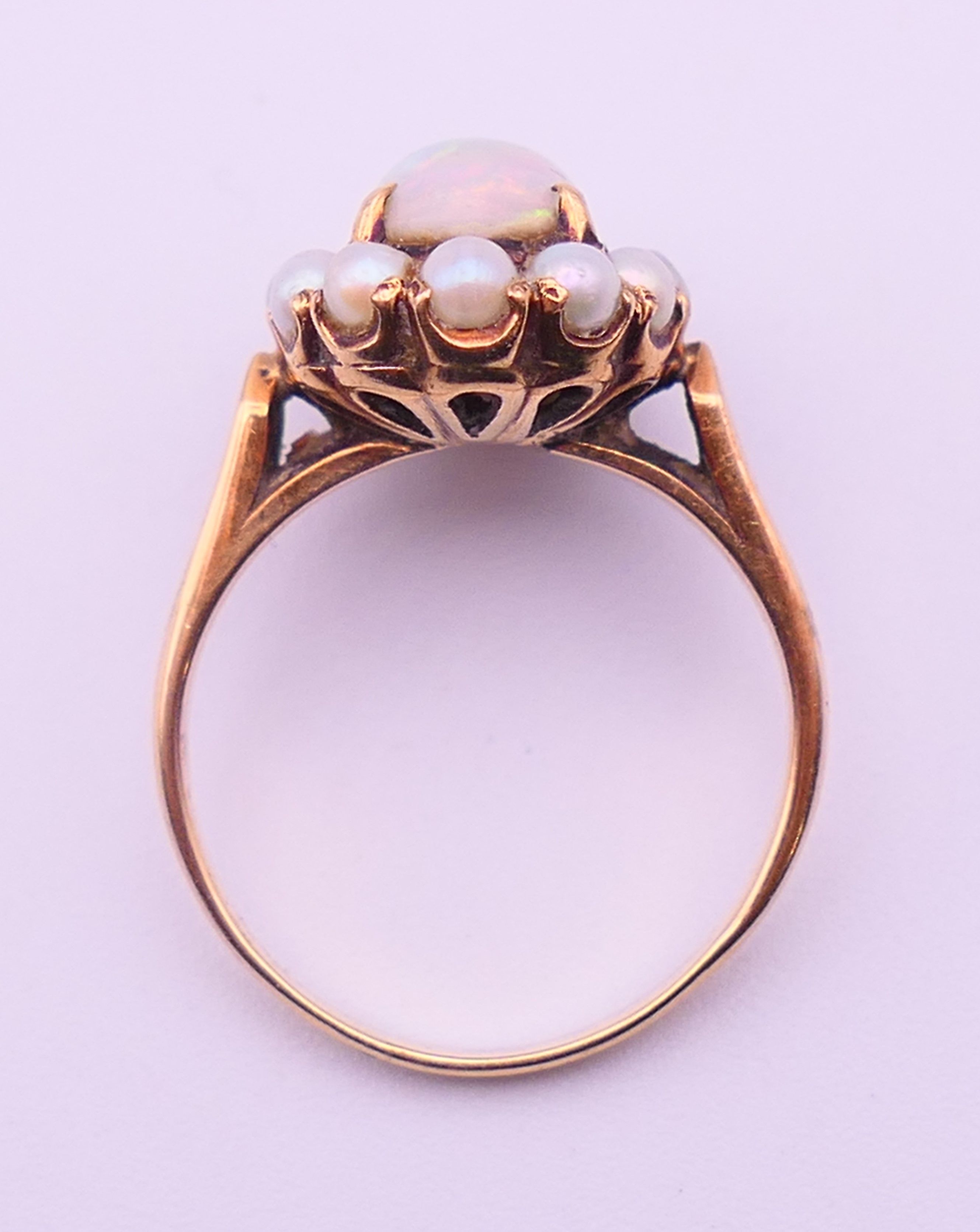 An unmarked gold, opal and seed pearl ring. Ring size M/N. 4 grammes total weight. - Image 5 of 5